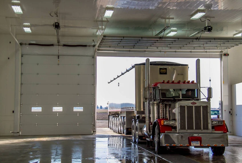 Commercial garage door with truck at loading bay