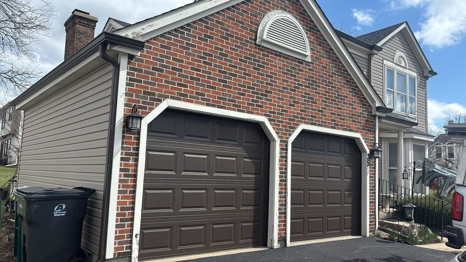 New residential garage door installation in Chicago home with stylish insulated panels