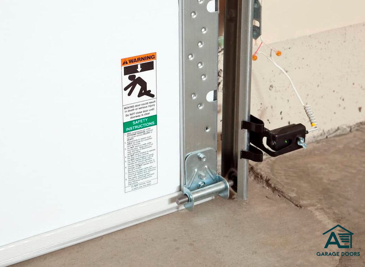 Aligning garage door photo-eye sensors to about six inches from the floor