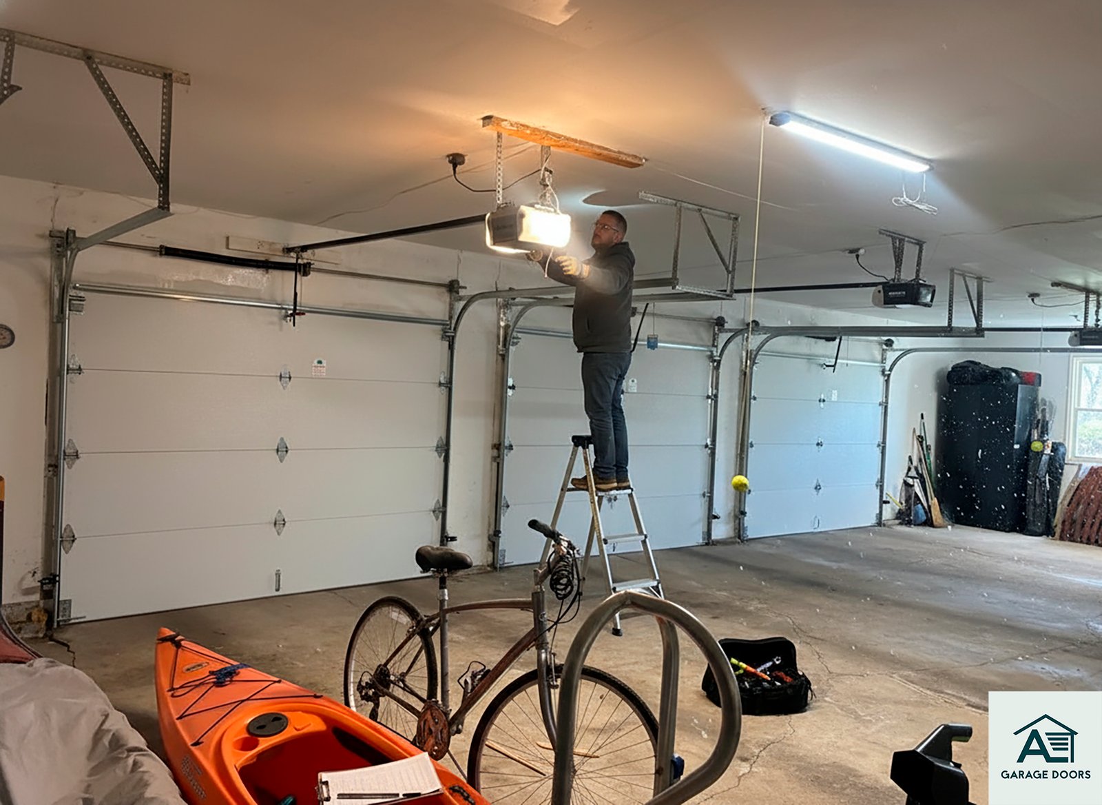 Technician performing a pre-winter garage door inspection in Chicago