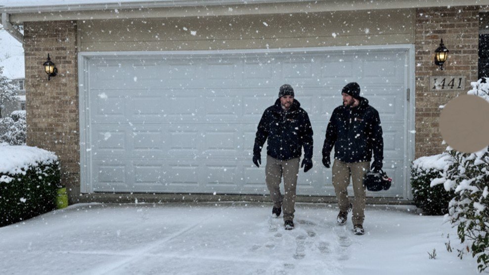 Chicago technician performing a winter garage door spring inspection