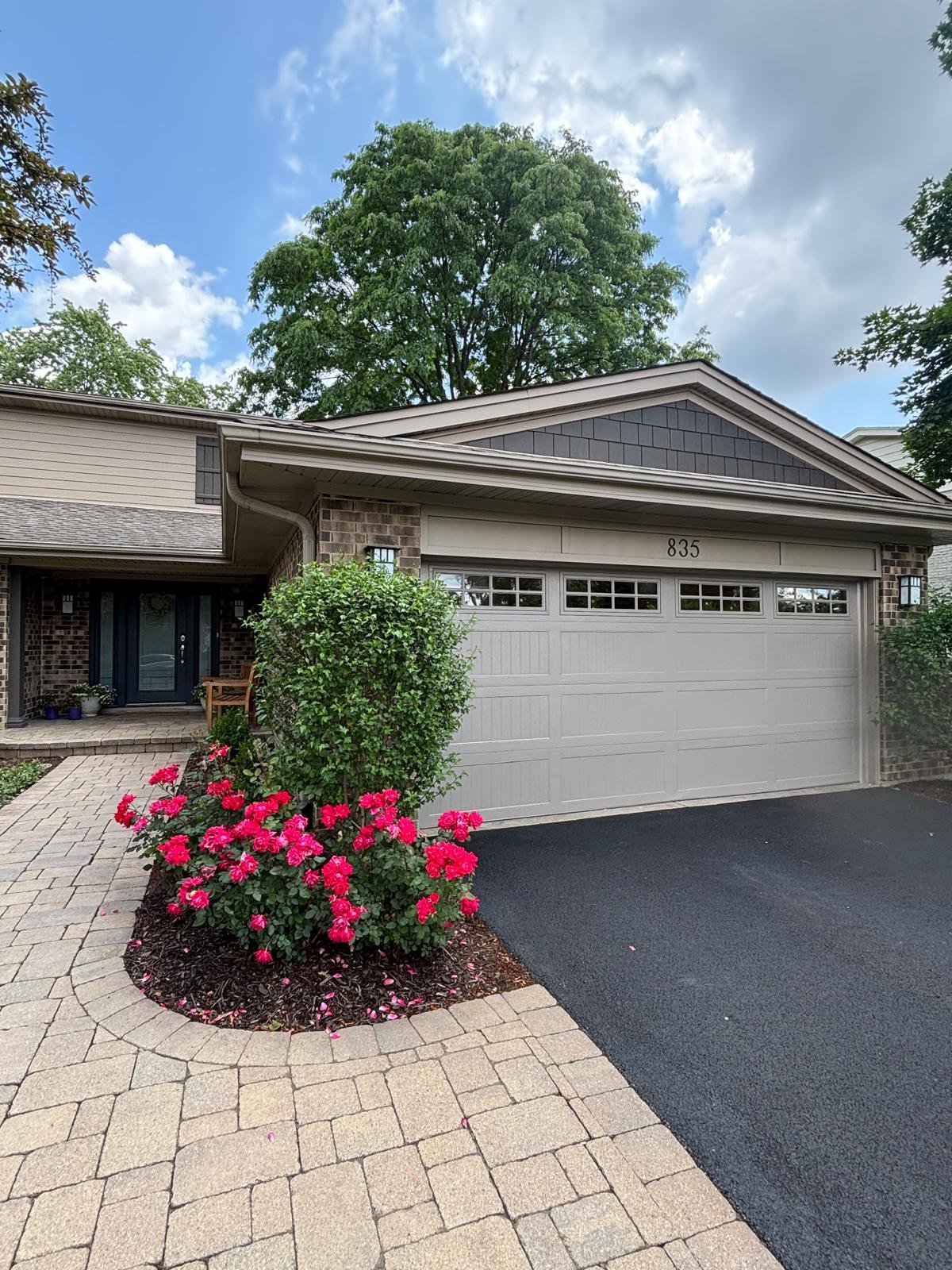 Garage door repair Crystal Lake IL — technician replacing torsion springs on residential home near Route 14